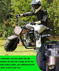 Person riding mini bike with close-up of carburetor. Carburetor Carb Kit For Monster Mega Moto 80Cc 105Cc Mini Bikes And Motovox MBX Series MBX10 MBX11 MBX12 Coleman B100 Baja Doodle Bug DB30 Dirt Bug RT100 Go Karts 79Cc 97Cc Engines With Throttle Cable visible.