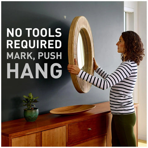 Woman using Claw Drywall Picture Hanger Variety Pack With 15, 25, And 45 Lb Hangers And Spot Markers, Heavyweight Hanging Solution For Room And Office Decor, Perfect For Mirrors Or Large Art, No Studs Needed, 8 Pack to hang mirror