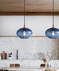 Pendant Lights Kitchen Island Hand Blown Glass UFO Ceiling Light Fixture With Seeded Bubbles above a modern kitchen counter