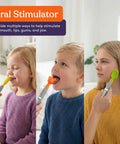 Three children using Calming Oral Motor Stimulation Kit With Six Soft Textured Heads, showing different tool attachments in use.