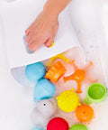 Freestanding Bath Toy Drying Bin With Quick Drain Base, Real No Mess Game Changer For Keeping Kids Toys Snappy And Mold Free, with toys in soapy water.