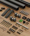60 Inch Box Rail Sliding Barn Door Hardware Kit With Ceiling Mount Heavy Duty Aluminum Track In Black Powder Coat Outdoor Ready And Anti Corrosion Fits Doors Up To 26 Inch Opening Up To 30 Inch Panel Width 1 Inch Door Thickness components laid out on a wooden surface.