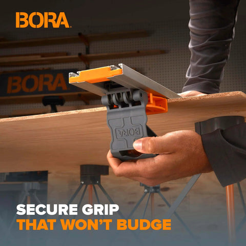 Person using NGX 96 Inch Clamp Edge System With Quick Connect And Quick Lock Lever for securing wood on workbench.