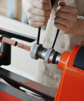 Crush Complex Turns On Your Lathe With This Badass ER32 Collet Chuck Kit Featuring Heavy Duty Base Five Precision Jaws being tightened on a lathe.
