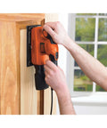 Person using Badass Compact Electric Orbital Sander With Rugged Ergonomic Design To smooth rough timber surface.