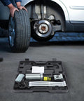 Rock Solid Heavy Duty Hydraulic Bearing Puller 20 Ton Capacity 2 And 3 Jaw Assembly in carrying case next to car tire.
