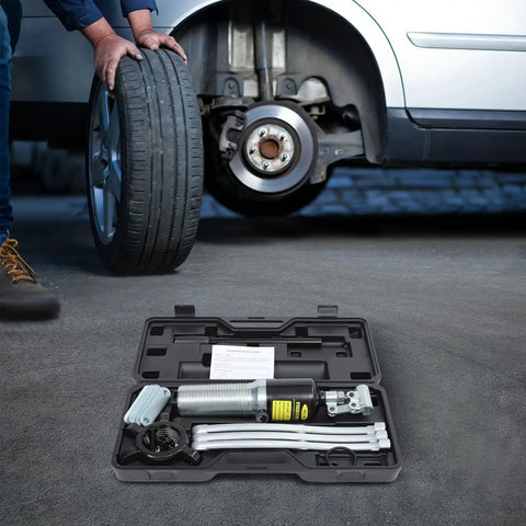 Rock Solid Heavy Duty Hydraulic Bearing Puller 20 Ton Capacity 2 And 3 Jaw Assembly in carrying case next to car tire.