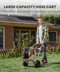 Man pushing Garden Hose Reel Cart With Wheels Stainless Steel Heavy Duty Hose Storage Carrier For Outdoor Use 200 Feet Of One Half Inch Capacity Mobile Water Hose Reel Cart in garden