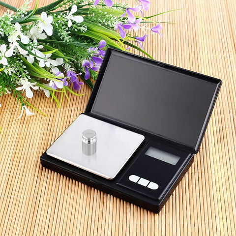 Digital scale with chrome-plated weight from 12 Piece Calibration Weights Set With Tweezers And Storage Box Pro Grade High Precision Steel Weights.