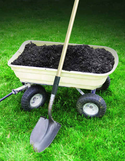 Shovel with Water Activated Quick Fix Tape for Easy DIY Repairs Seal Leaks Cracks And Tears on handle in front of garden cart with soil.