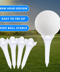 30 Pack 1.5 Inch Short Plastic Golf Tees With Four Prongs For Less Friction And Side Spin on a grassy field