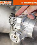 One Quarter Inch Drive Mini Damaged Bolt And Stud Extractor 51013 in use on engine component with hand tool.