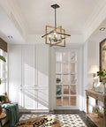 Four-Light Farmhouse Chandelier With Imitation Wood Grain And Matte Black Finish hanging in a bright entryway.