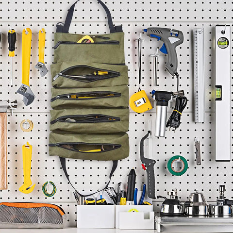 Heavy Duty Tool Roll Up Bag Portable Organizer For Mechanics Electricians And Repair Pros Waterproof Oxford Cloth Zipper Pouch Green Durable Tool Storage Case For Home Shop And On The Go hanging on a workshop pegboard.