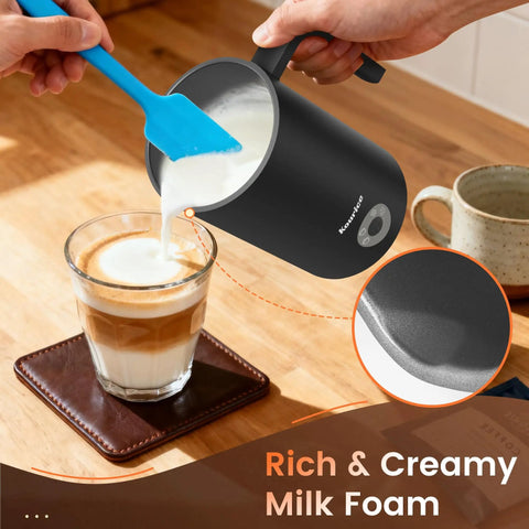 4-In-1 Electric Milk Frother And Steamer For Home Barista Vibes With Hot Dense Foam And Cold Foam Makes Lattes Cappuccinos And Iced Coffee Quiet One-Touch Operation Easy To Clean pouring milk foam into coffee