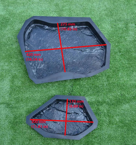 Two ABS molds from Six Piece Concrete Molds Set For Flagstone Pavement Stones DIY Kit on grass, showing measurements and textured surface.