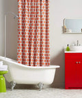 Bathroom with clawfoot tub, red vanity, and patterned shower curtain