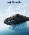 Total Game Changer Portable Charger With Four Built In Cables And Massive Twenty Thousand Mah Fast Charging Power Bank For Phones Tablets And Laptops on a leather surface.