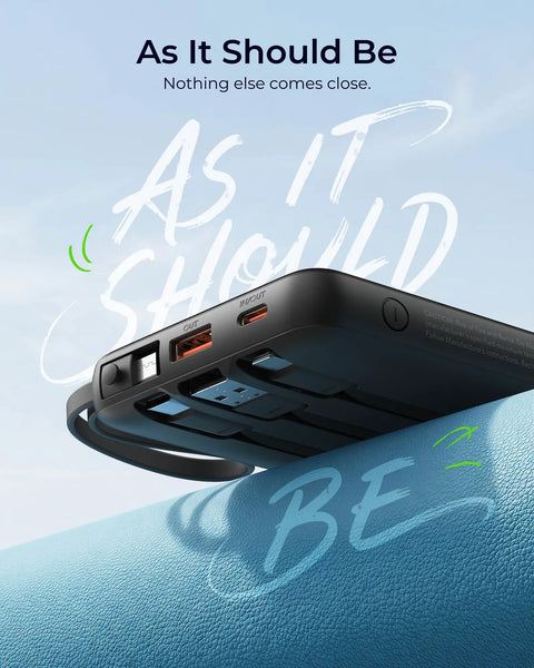 Total Game Changer Portable Charger With Four Built In Cables And Massive Twenty Thousand Mah Fast Charging Power Bank For Phones Tablets And Laptops on a leather surface.