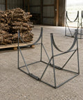 Heavy Duty Welded Steel Yam Bundling Rack Straight Up Sturdy Farm Crop Organizer For Field Harvest Storage with wooden bundles behind.