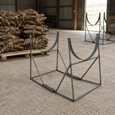 Heavy Duty Welded Steel Yam Bundling Rack Straight Up Sturdy Farm Crop Organizer For Field Harvest Storage with wooden bundles behind.