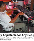 Person using Adjustable Platform Keyboard Stand for Live Gigs and Studio Use, steel with foam pads, height 25-33 in, width 28.1-43 in.