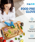No Sweat Blue Nitrile Gloves Medium 100 Count Built Tough At Three Mil Thick Powder Free Latex Free With Slick Textured Grip Ideal For Kitchen Cooking House Cleaning And Beauty Salons Smooth Reliable Safety For Any Job You Grab, worn during food prep with vegetables.