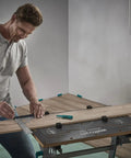 Pro Shop Grade Universal Angle And Try Square Measuring Marking And Cutting Tool Built With Heavy Duty Steel used by a man for precise marking.
