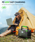 Woman using laptop outside tent with Massive 999Wh Portable Power Station With 1000W Pure Sine Wave AC Output And 2000W Peak