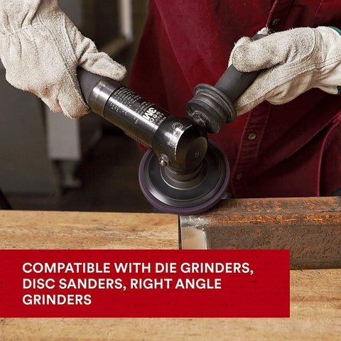 Worker using SiC Extra Coarse Pro Disc For Metal Quick Rust Paint And Coating Removal With Reengineered Fiber on metal surface