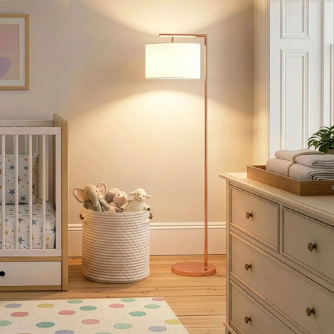 Rose Gold Montage Modern LED Floor Lamp for Living Rooms and Offices next to crib, softly lighting nursery corner with warm white light