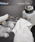Close-up of a lint-free cleanroom wipe, 6x6 in, double-knit polyester, cleaning a circuit board with gloves