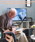 Elderly man reading under an Awesome Real Glass Magnifier Lamp With Light And Stand 8x Magnification LED Five Color Modes Stepless Dimmable