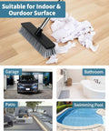 Heavy Duty Push Broom With Adjustable Stainless Handle And Tough Bristles Built For Sweeping Decks Garages And Driveways with debris on floor.