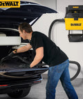 Man using Heavy-Duty Wall-Mount Wet-Dry Vacuum For Garage And Shop, 6 Gallon Capacity, 5 Peak HP Motor, DXV06G Beast Mode in car trunk