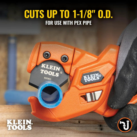 Close-up of lightweight PEX pipe and tubing cutter with soft molded handles and pierce point blade cutting blue tubing.