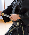 Person withdrawing Unsharpened Stainless Steel Wakizashi Iaito For Iaido Practice 21 Inch Blade With Bo Hi Fuller Dope Safe
