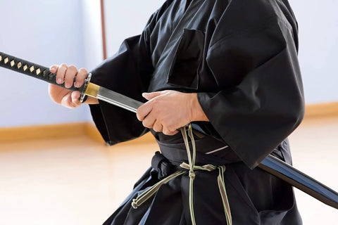 Person withdrawing Unsharpened Stainless Steel Wakizashi Iaito For Iaido Practice 21 Inch Blade With Bo Hi Fuller Dope Safe