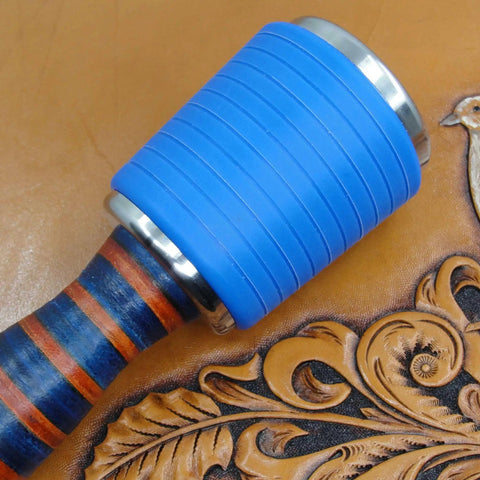 Close-up of Professional Leather Tooling Maul with blue nylon head and striped leather handle on embossed leather background.
