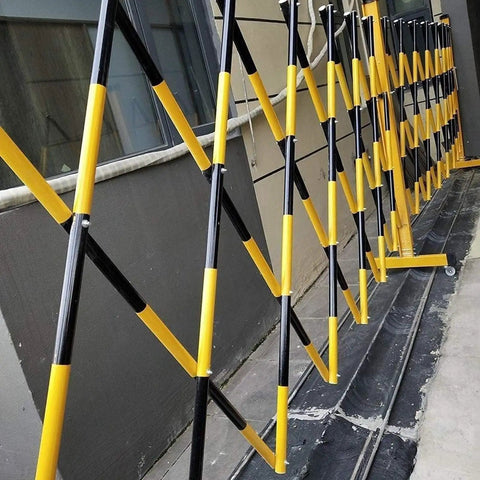 Adjustable Telescopic Safety Barrier With Slick Glide Casters, Grab And Go Pop Up crowd control fence in black and yellow.