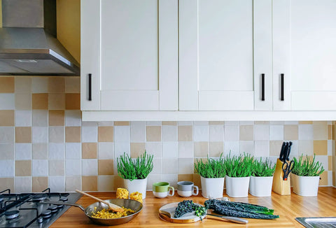 Knockout Matte Black Square Cabinet Handles With Hella Durable Solid Build And Zero Fuss Installation For Modern Kitchen And Bathroom Storage Upgrade Top Shelf 30 Pack Set displayed on white kitchen cabinets.