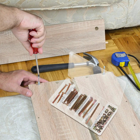 Person assembling furniture using 49 Piece M6 X 40-80mm Socket Drive Hex Screws And Barrel Nuts Set For Furniture Connections And Pet Gate Replacement