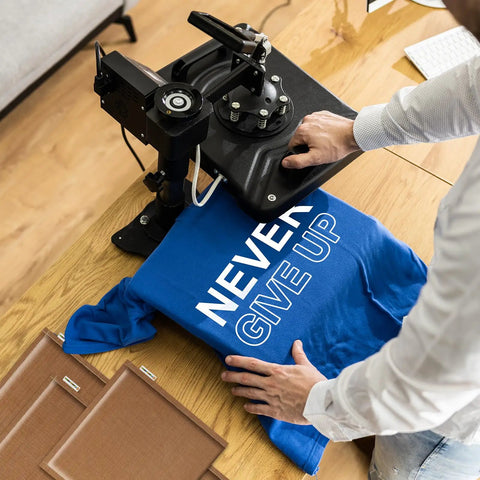 Heat Press Pillow Bundle With Five Size Mats Teflon Pillows For Sublimation with heat press machine and blue T-shirt.