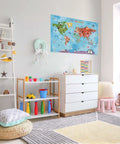 World Map Cartoon Animals Canvas Banner For Classrooms And Playrooms Kid Friendly Educational Wall Decor With Fun Animal Illustrations 30 By 20 Inch Durable Fabric Banner With Brass Grommets in a playroom setting.