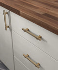 Champagne bronze gold cabinet handles on white drawers paired with a wooden countertop. Adjustable Drawer Pulls Five Pack Champagne Bronze Gold Cabinet Handles For Kitchen Cabinets Dressers And Cupboards Dope Finish For A Fresh Modern Look Fits 1 3 8 To 6 5 16 Inch Hole Center With Adjusta Pull Design For Easy Swap.