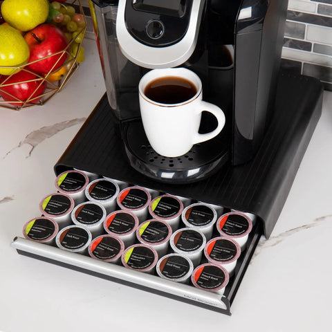 36 Pod Single Serve Coffee Pod Drawer Organizer For Countertop Coffee Station Base, Holds Up To 36 Pods, with coffee cup on top.