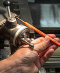 Extended Length Punch and Chisel Set for Metalworking and Carpentry, Pro Grade 12 Piece in use on a metal machine