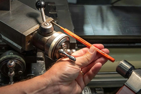 Extended Length Punch and Chisel Set for Metalworking and Carpentry, Pro Grade 12 Piece in use on a metal machine