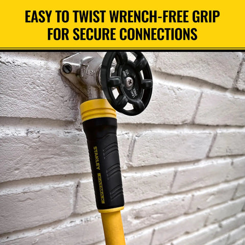 Heavy Duty Pro Grade Garden Hose With PolyFusion Technology at connection point on a brick wall