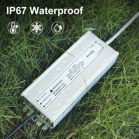All Weather 100W 12V DC LED Driver Power Supply IP67 Waterproof Outdoor Transformer on grass with raindrops